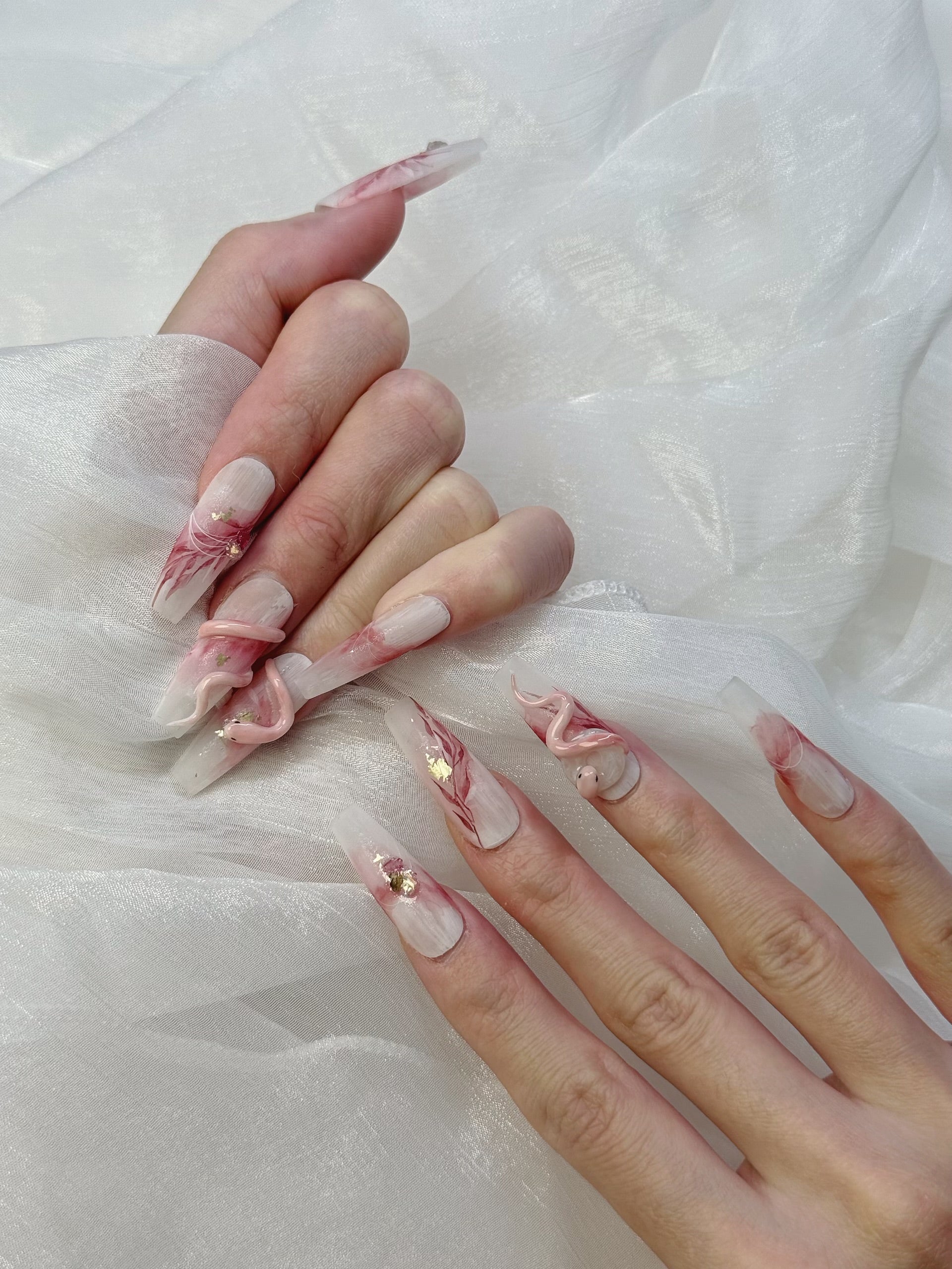 Model Wearing Lunar Serpent Press-On Nails – Perfect for Halloween and Mystical Events