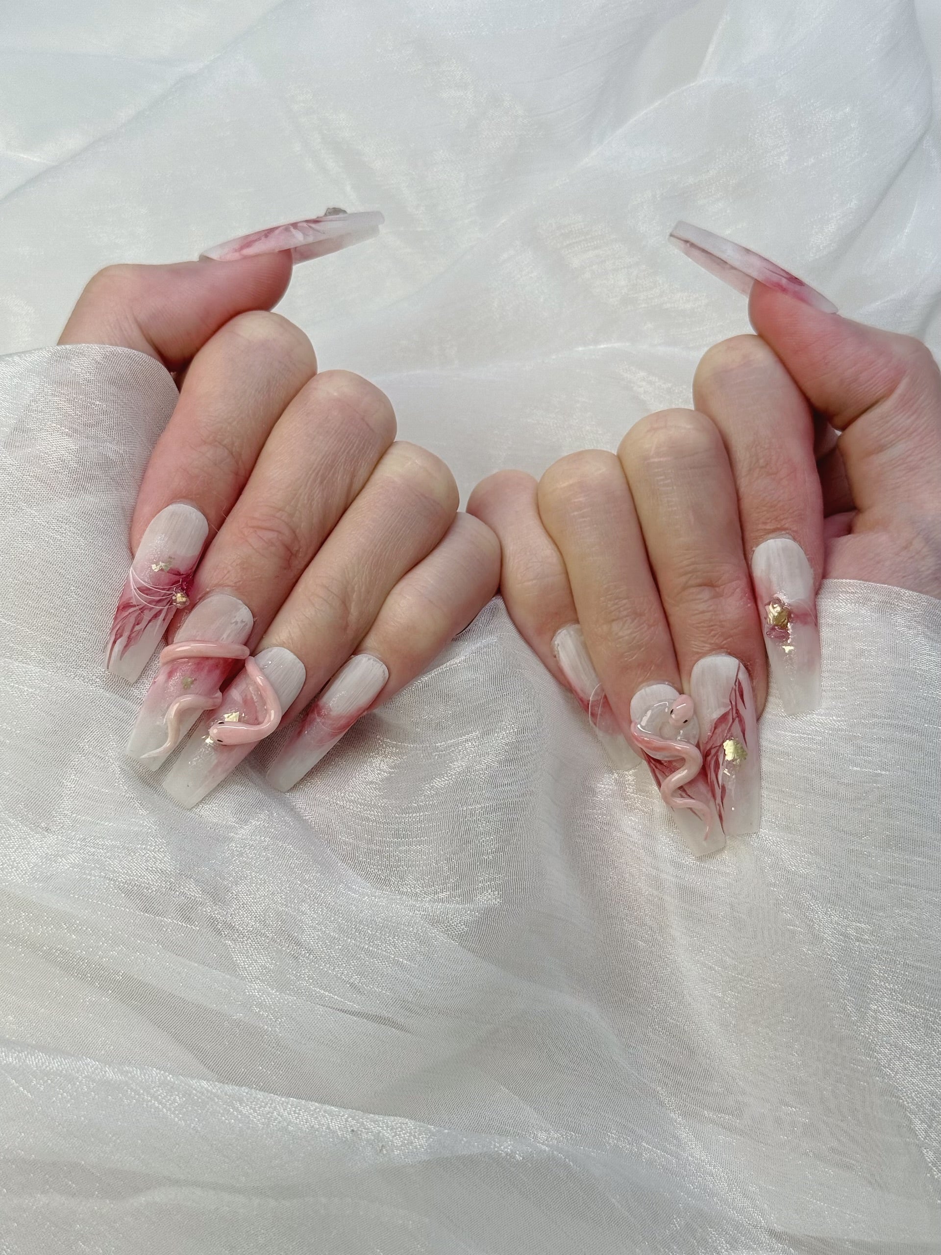 Model Wearing Lunar Serpent Press-On Nails – Perfect for Halloween and Mystical Events
