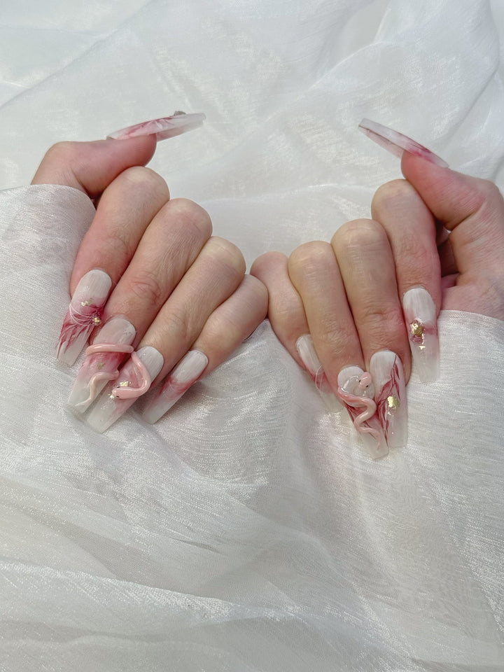 Model Wearing Lunar Serpent Press-On Nails – Perfect for Halloween and Mystical Events