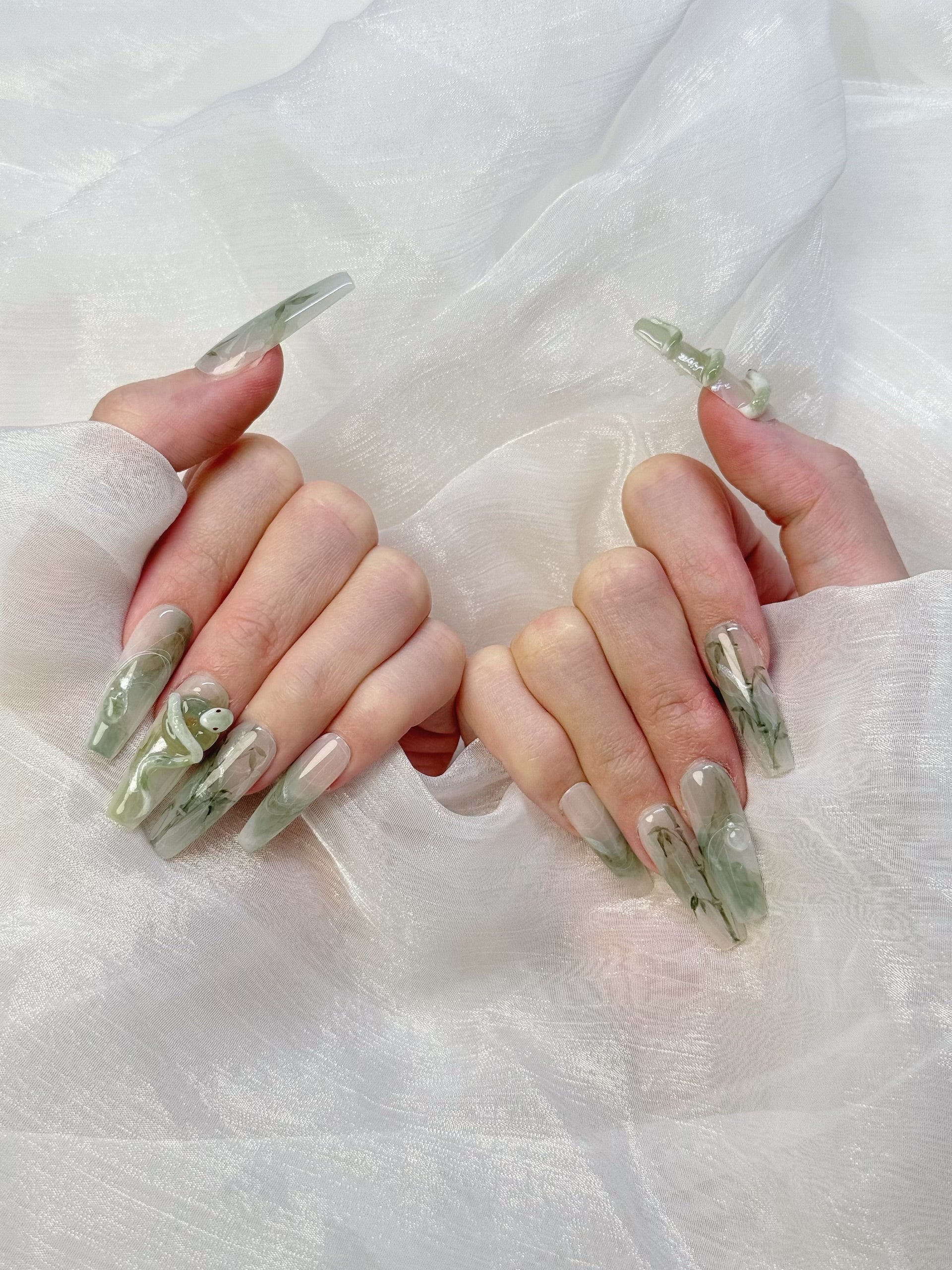 Model Wearing Jade Serpent Press-On Nails – Stylish Green Jade Nail Look