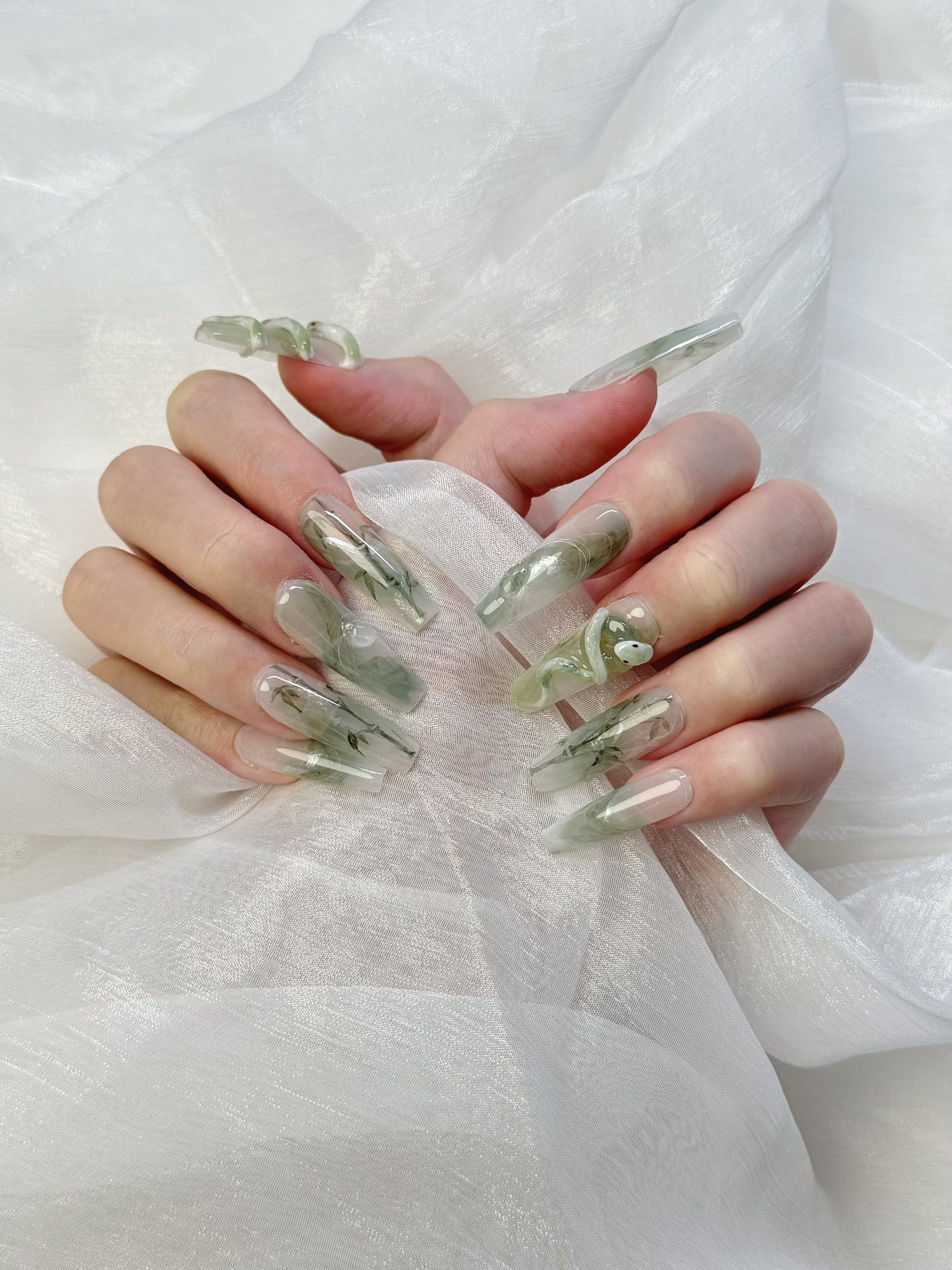 Model Wearing Jade Serpent Press-On Nails – Stylish Green Jade Nail Look