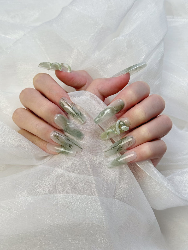 Model Wearing Jade Serpent Press-On Nails – Stylish Green Jade Nail Look