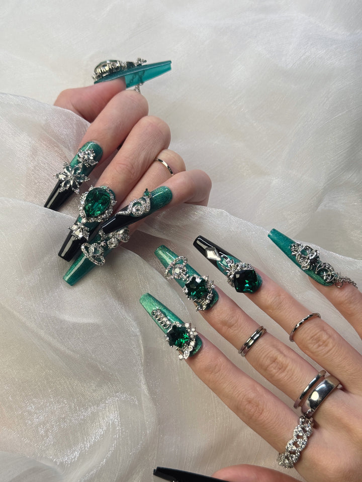 Model Wearing Emerald Crown Press-On Nails – Perfect for Royal Occasions