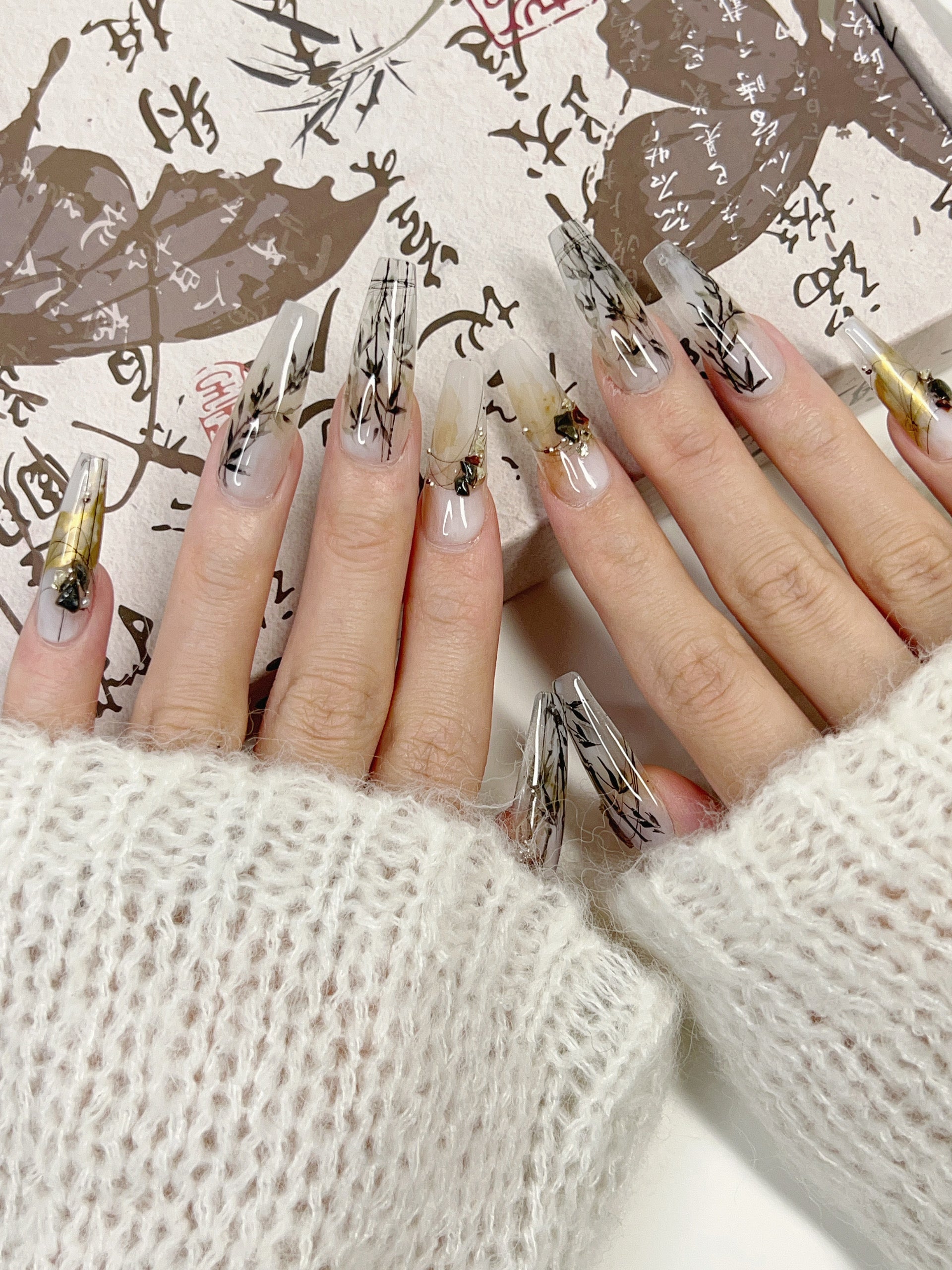 Model Wearing Ink Whisper Press-On Nails – Perfect for Creative Events